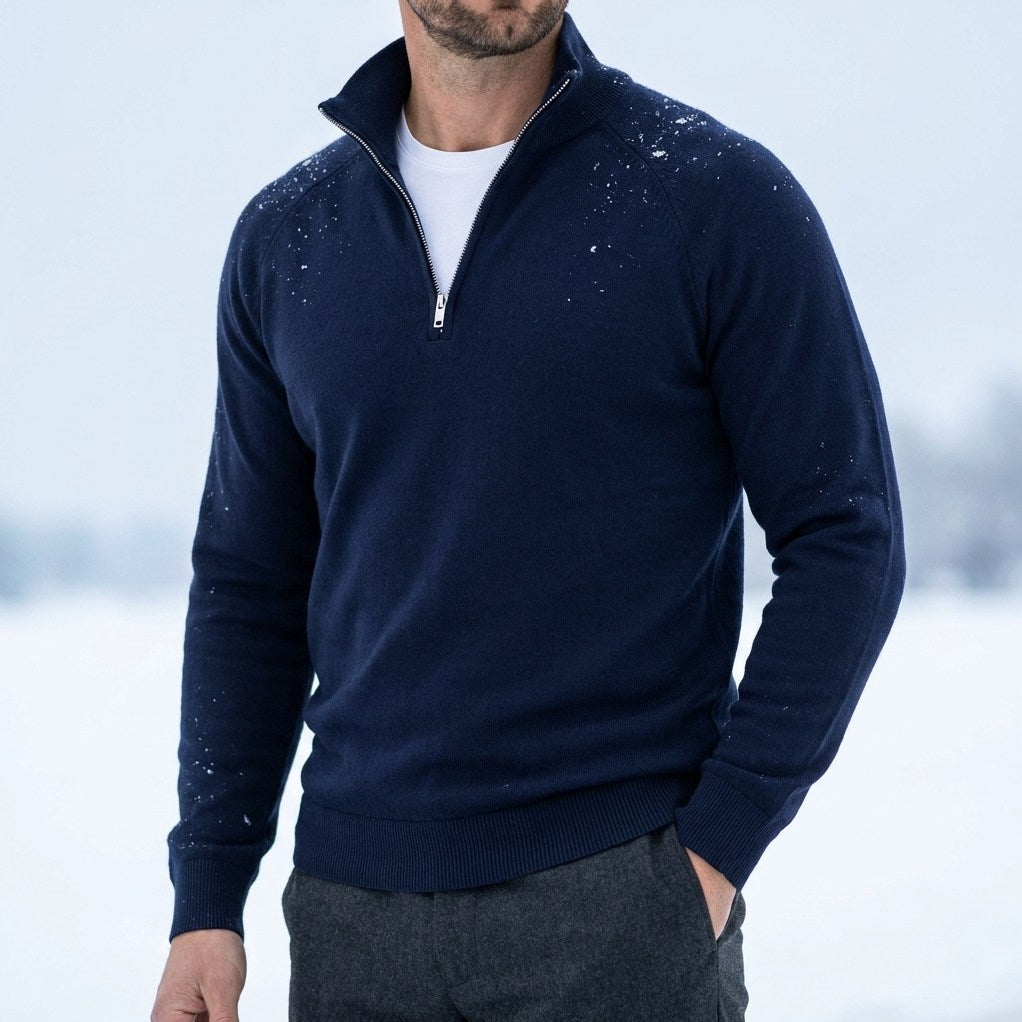 Man wearing the Darkwave Regal Pullover Sweater in Blue outdoors in the snow